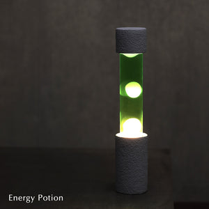 点灯すると呼吸をするように流動的に形を変えながらコンクリートの筒を行き来する Dripping Lamp（ドリッピングランプ）