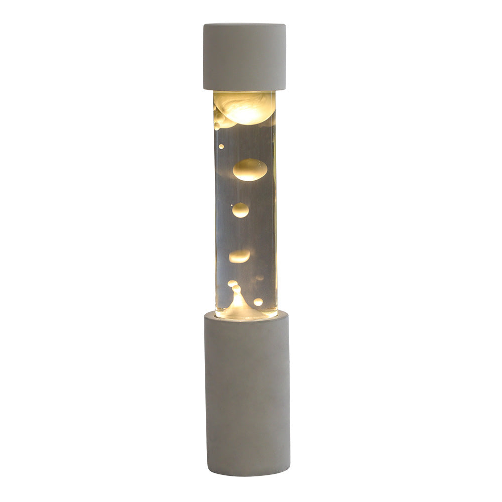 点灯すると呼吸をするように流動的に形を変えながらコンクリートの筒を行き来する Dripping Lamp（ドリッピングランプ）