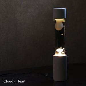 点灯すると呼吸をするように流動的に形を変えながらコンクリートの筒を行き来する Dripping Lamp（ドリッピングランプ）