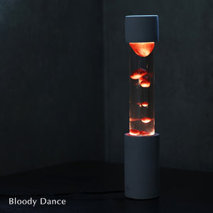 点灯すると呼吸をするように流動的に形を変えながらコンクリートの筒を行き来する Dripping Lamp（ドリッピングランプ）