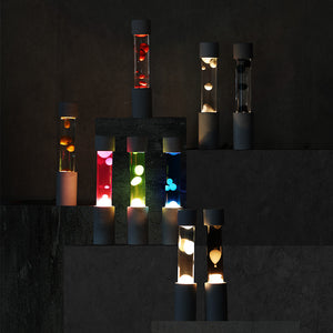 点灯すると呼吸をするように流動的に形を変えながらコンクリートの筒を行き来する Dripping Lamp（ドリッピングランプ）