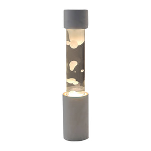 点灯すると呼吸をするように流動的に形を変えながらコンクリートの筒を行き来する Dripping Lamp（ドリッピングランプ）